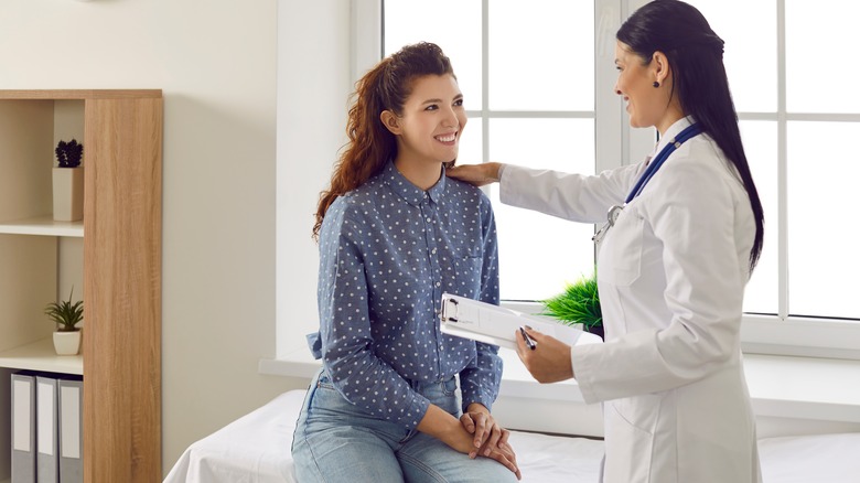 Doctor consulting patient 