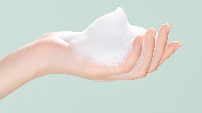soapy foam on open hand