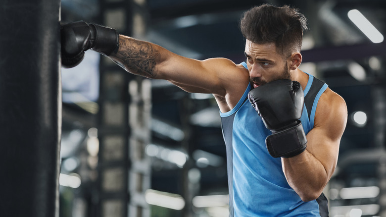 A man boxing in a gym