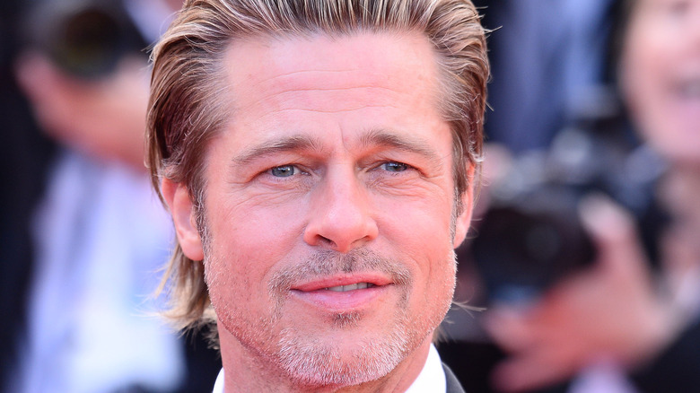 close up of brad pitt on red carpet