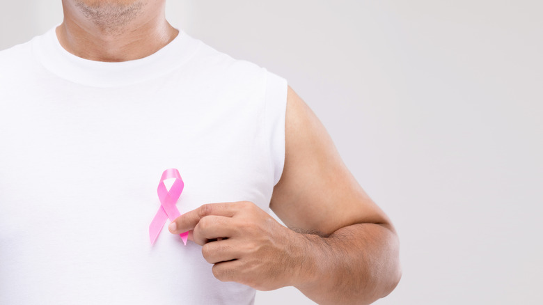 man holding cancer prevention ribbon 