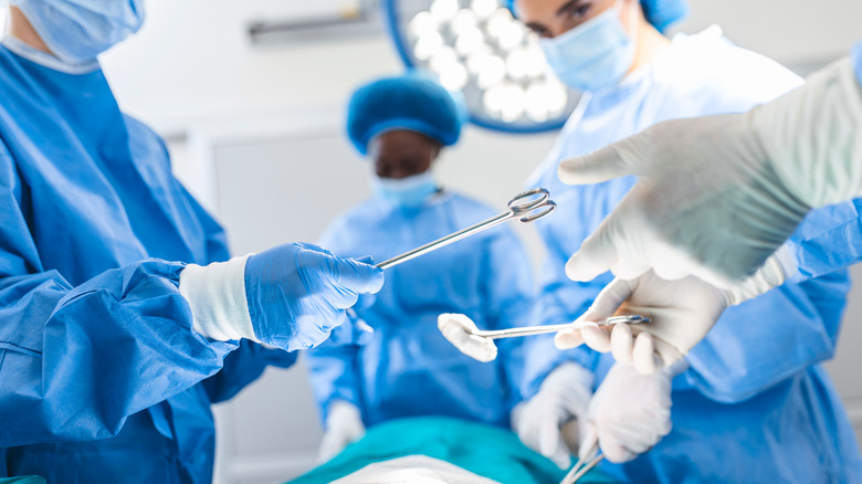 many doctors doing surgery