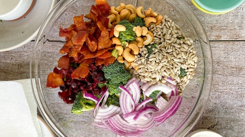 unmixed, undressed broccoli salad in bowl