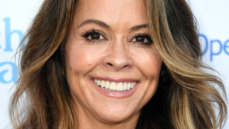 Brooke Burke smiling at event