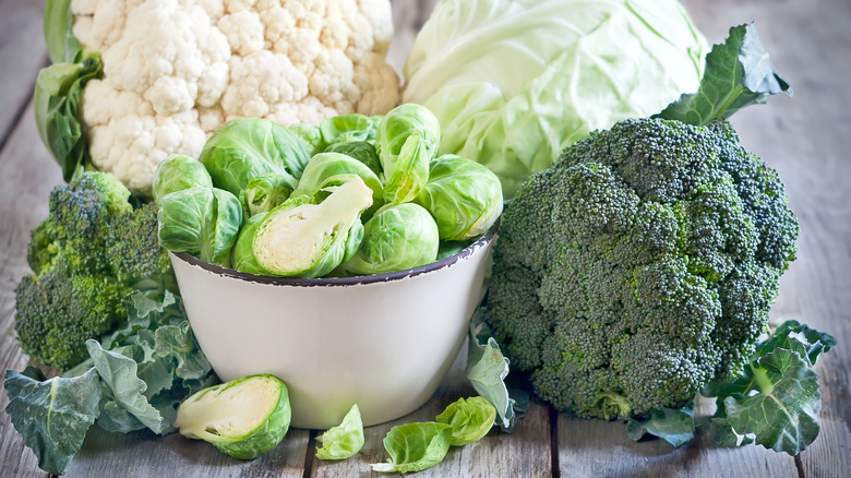 Brussels sprouts in bowl with cabbages