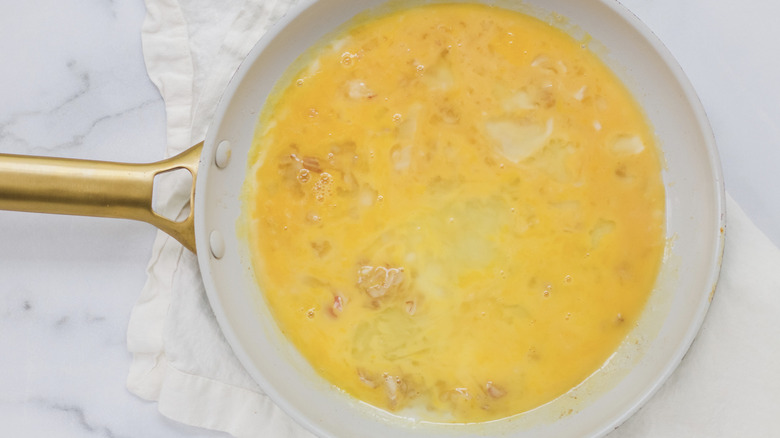 Raw egg in a pan
