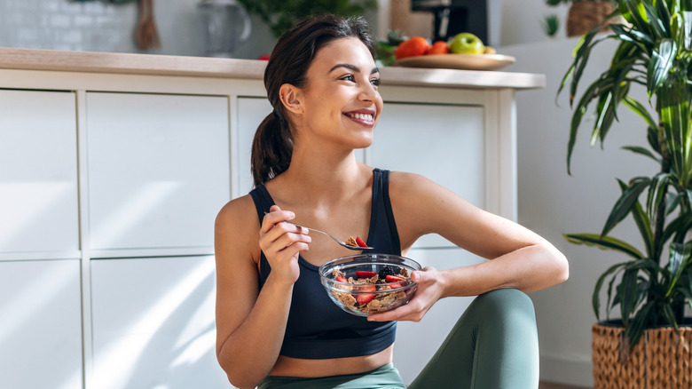 healthy woman eating muesli
