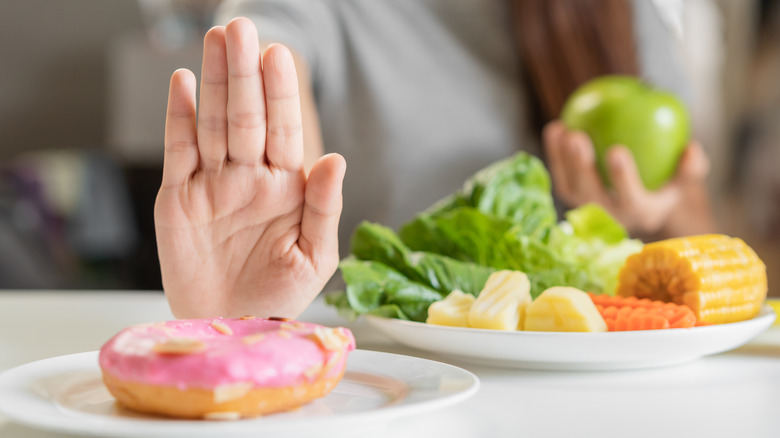 woman saying no to sugar food
