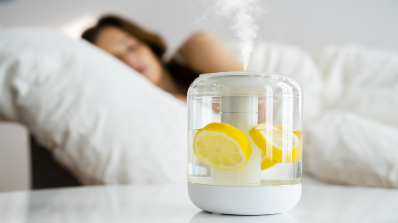 Woman with lemons by bedside