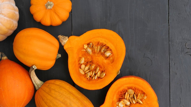 pumpkins, one sliced in half