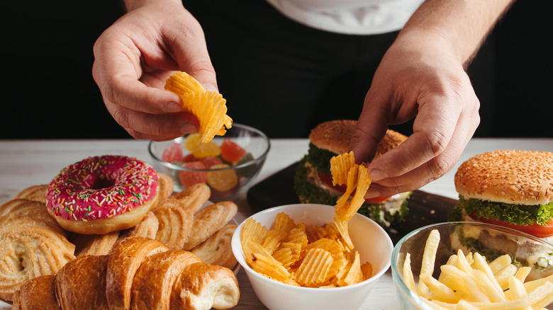 Person eating junk food
