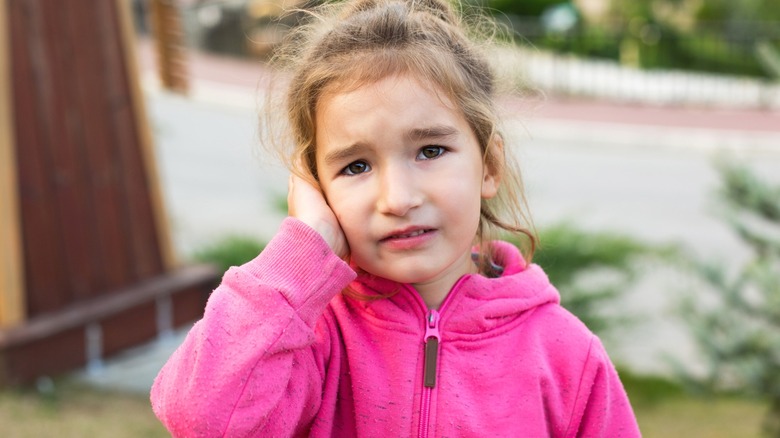 young girl with ear pain