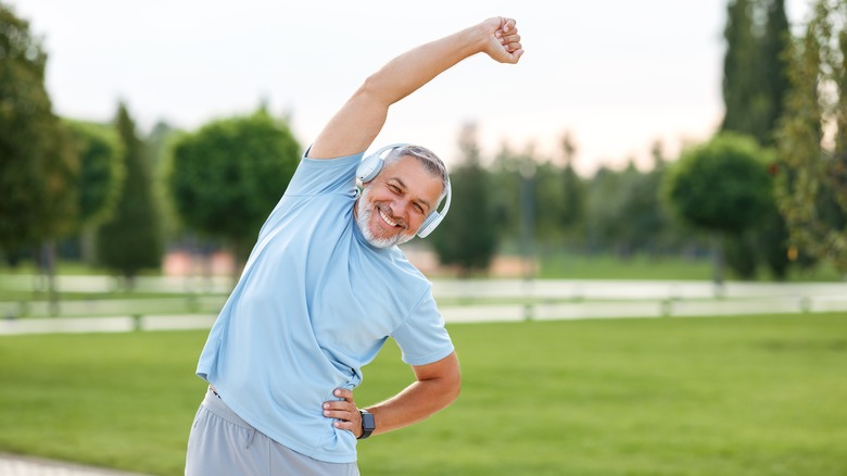 Older man exercising outside
