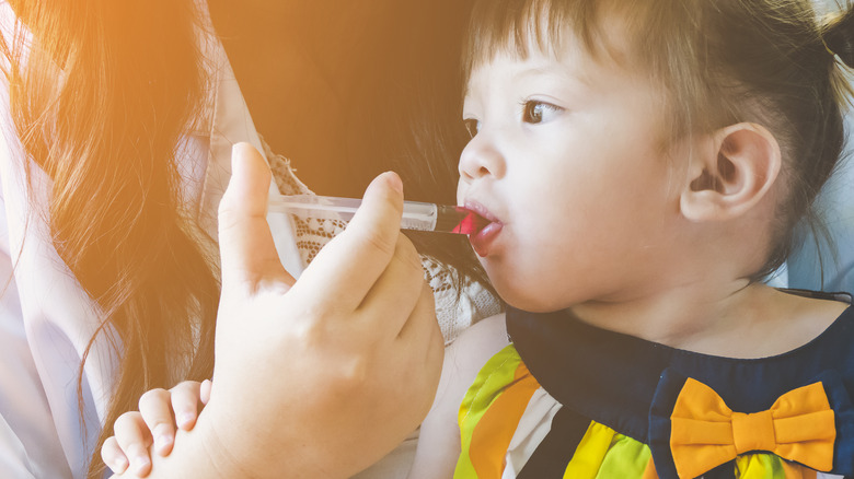 baby taking medicine