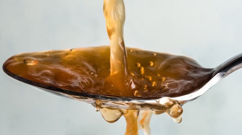 apple cider vinegar on a spoon