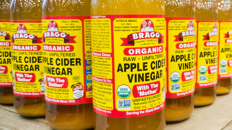 bottles of apple cider vinegar on shelf