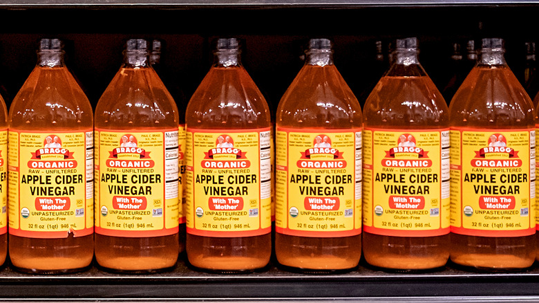bottles of apple cider vinegar on shelf