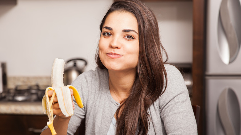 woman eating a banana