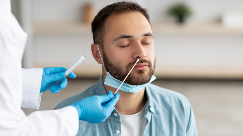 Man receiving a COVID test