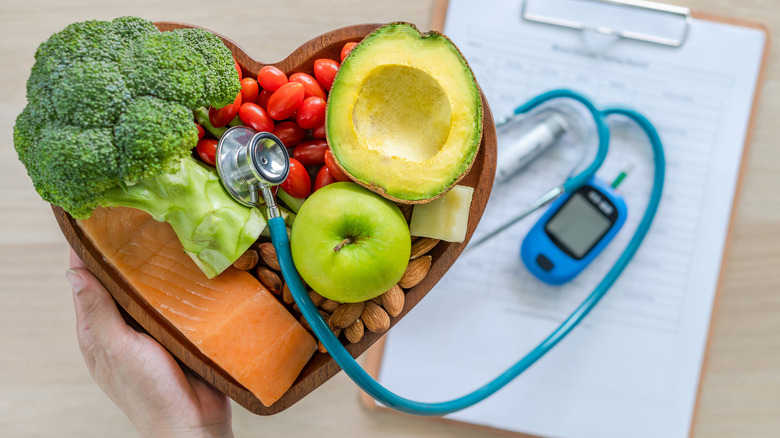 a heart filled with food and a stethoscope