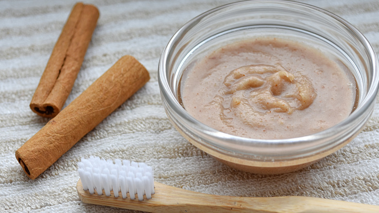 Cinnamon toothpaste mixture with a toothbrush
