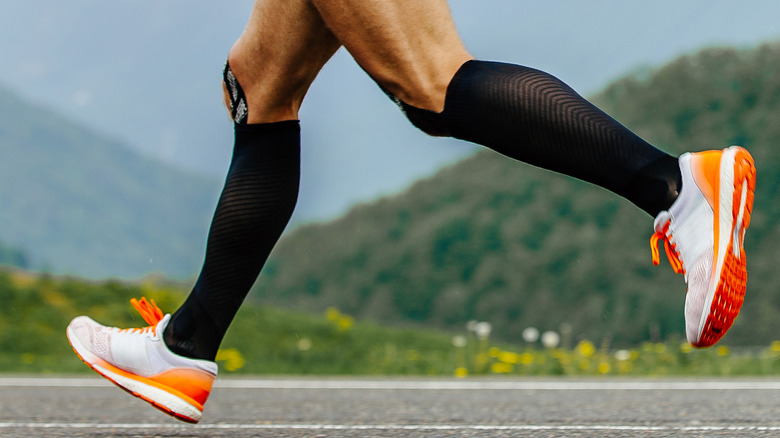 Male runner wearing compression socks 