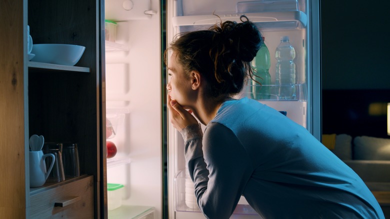 woman having meal late at night