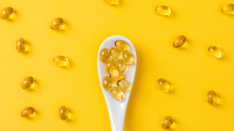 a spoon full of fish oil supplements