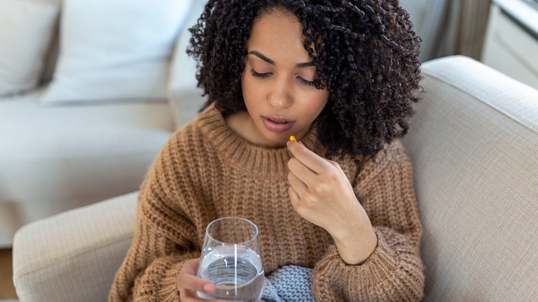 woman questioning taking supplement