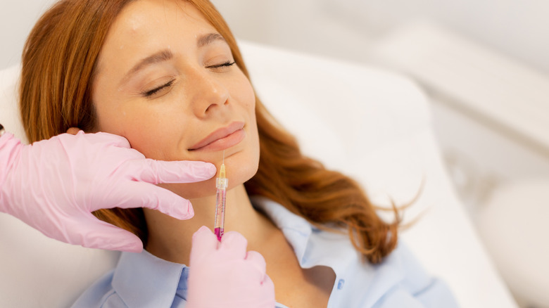 woman getting lip injections