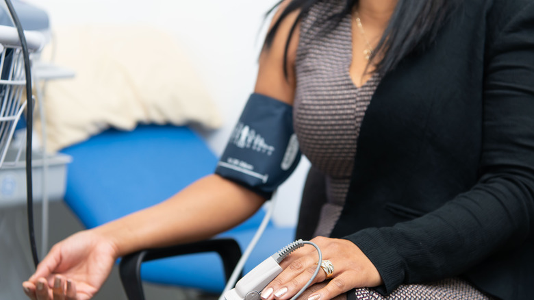 Woman getting blood pressure taken