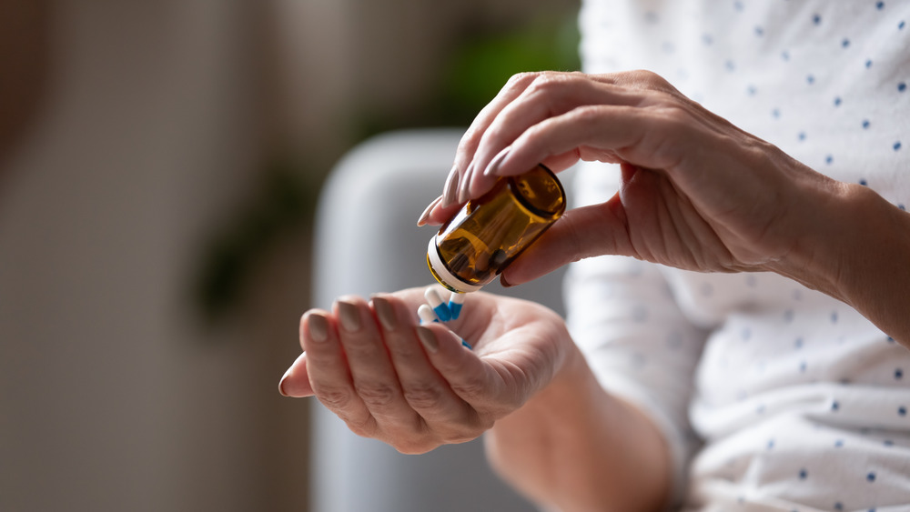 woman taking a pill