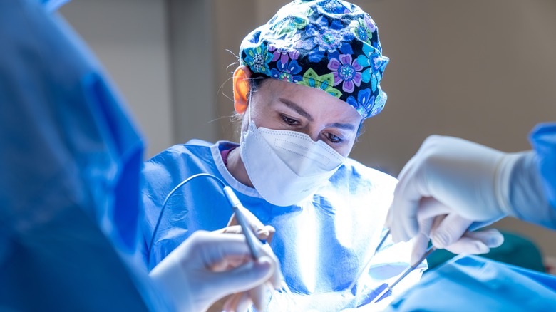 A surgeon operating