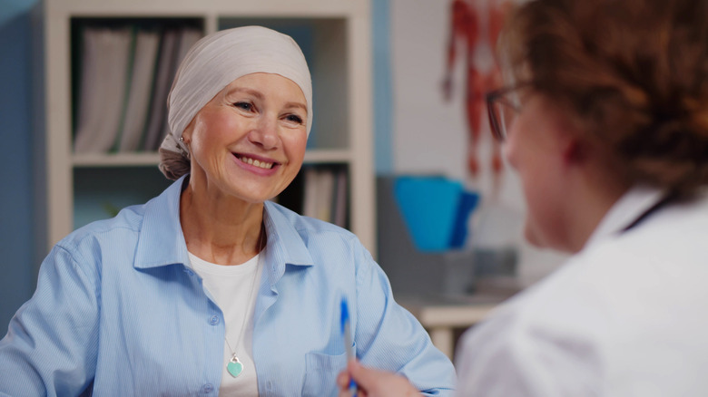 A cancer patient and their doctor