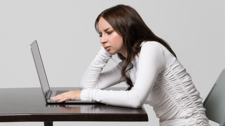 Woman slumped at desk