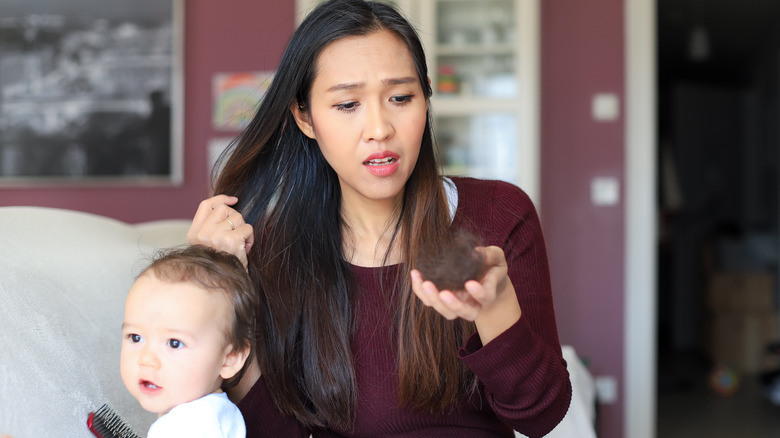 woman with postpartum hair loss