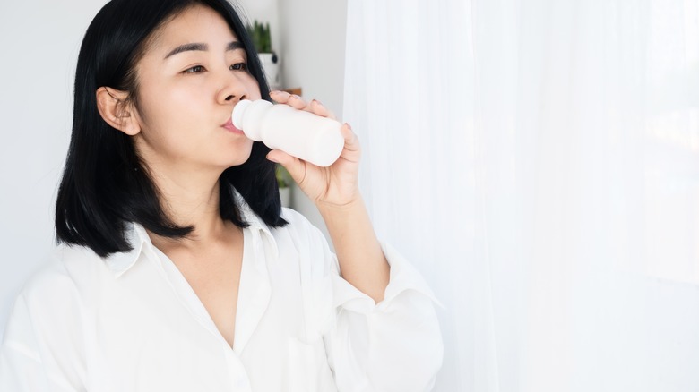 woman drinking yogurt