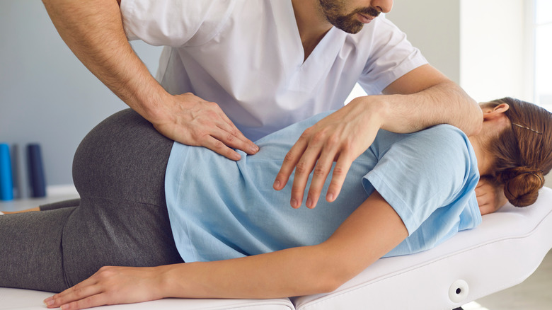 chiropractor treating patient