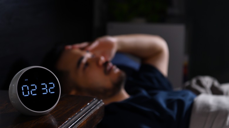 man struggling with sleep