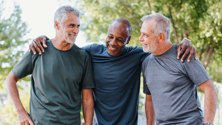 three fit older men outdoors