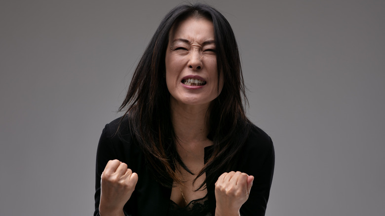 woman yelling in pain