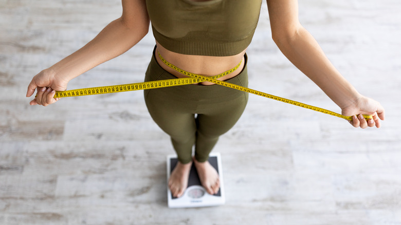 woman standing on scale