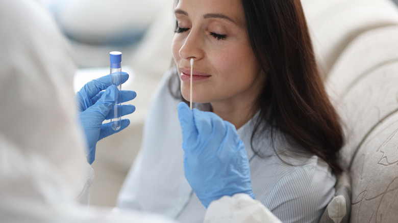 Woman getting nasal swab test