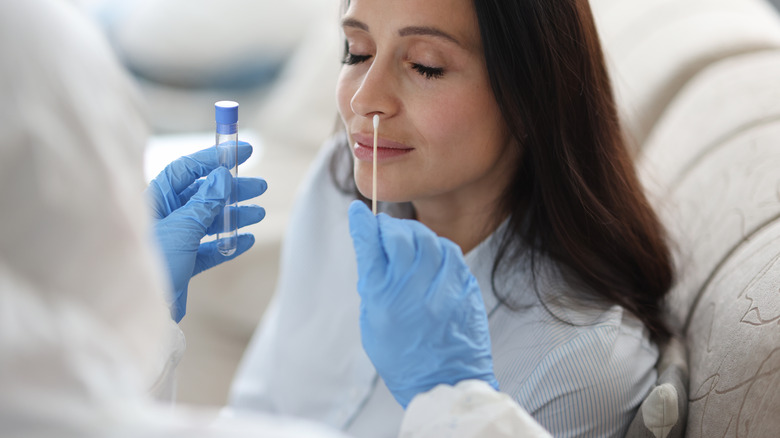 Woman getting nasal swab test