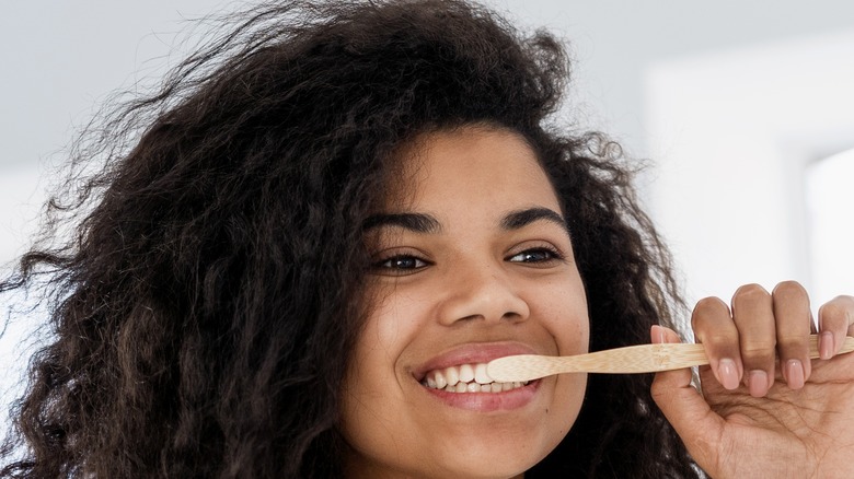 Woman brushing teeth 
