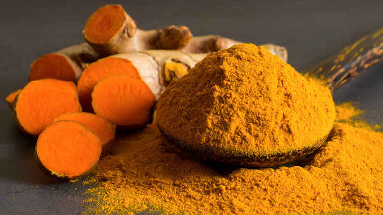 turmeric root and turmeric powder side-by-side