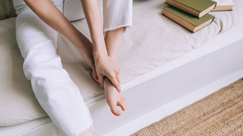 person holding feet