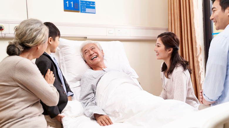 Family visiting grandfather in hospital 