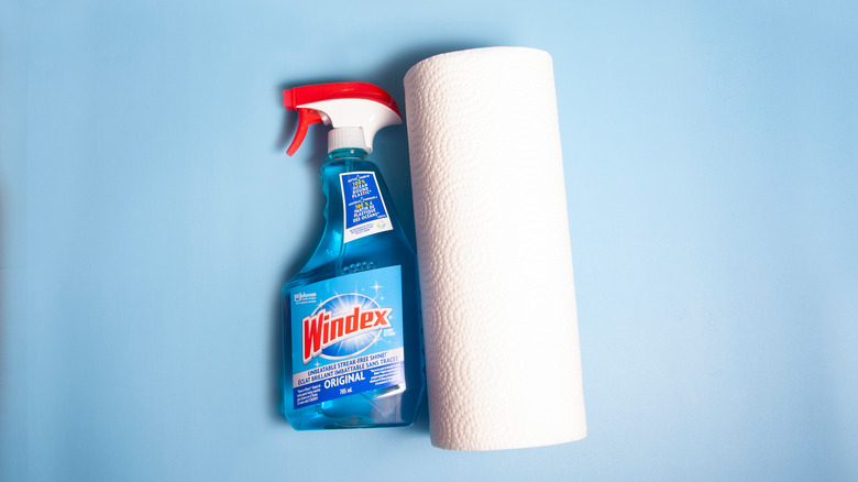 Windex bottle next to paper towels