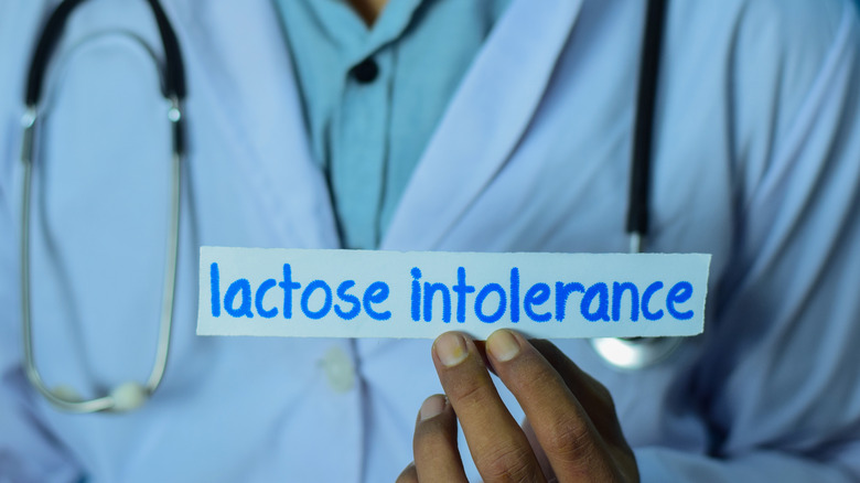 doctor holding paper reading lactose intolerance